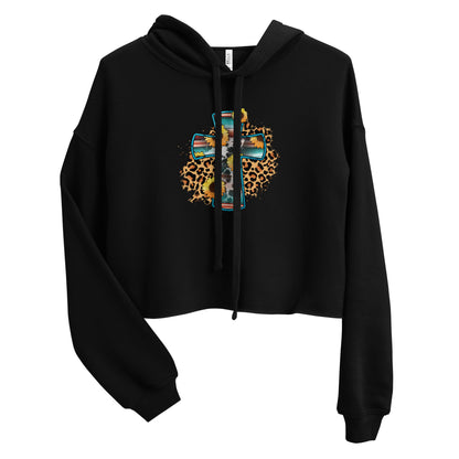Women's black cropped Christian hoodie featuring a colorful floral cross with sunflower and leopard print design.