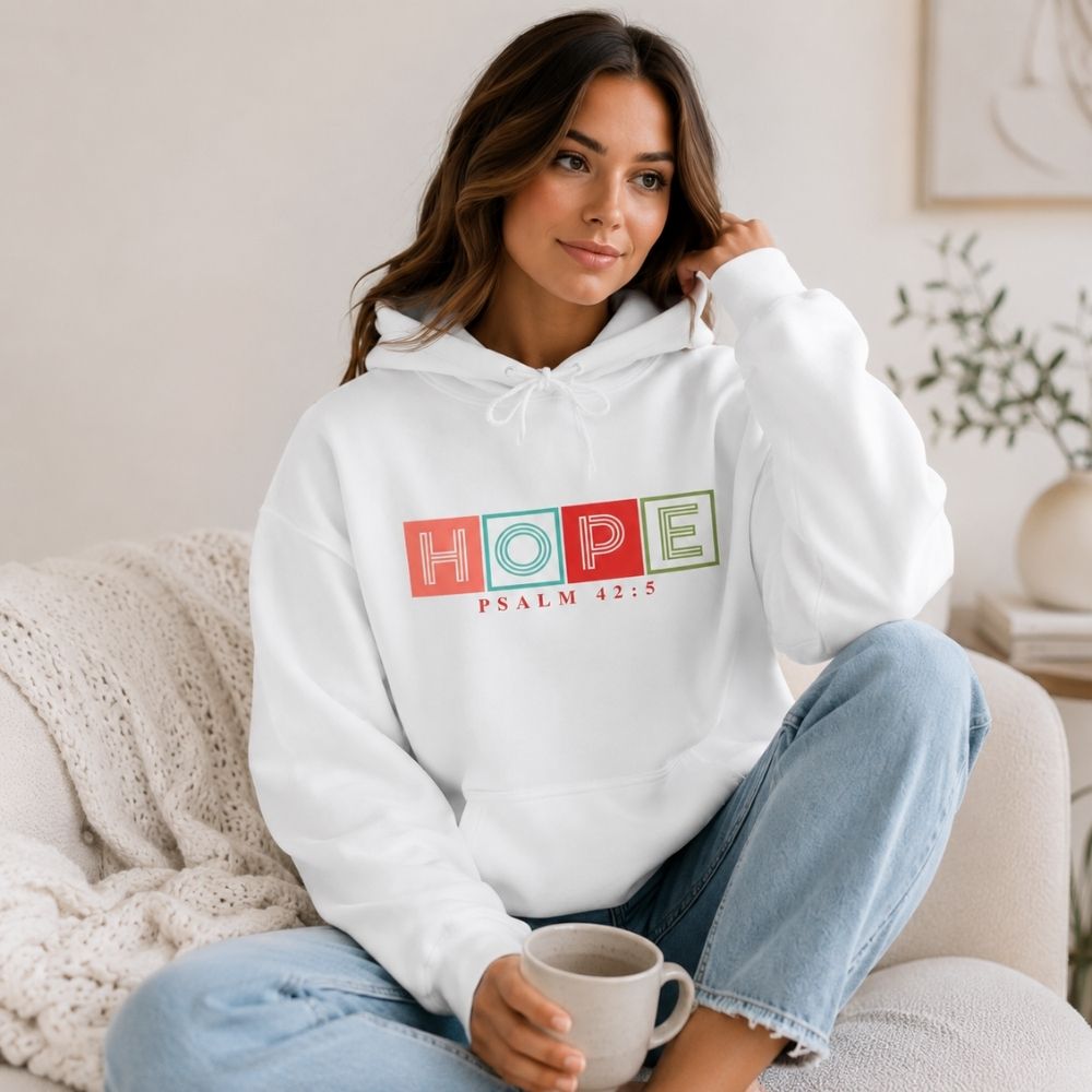 Woman wearing the Hope Psalm 42:5 premium white hoodie by The Avielle