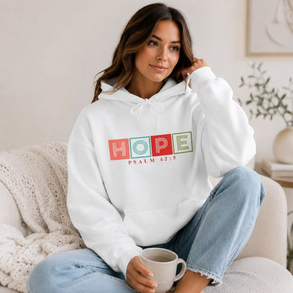Woman wearing the Hope Psalm 42:5 premium white hoodie by The Avielle