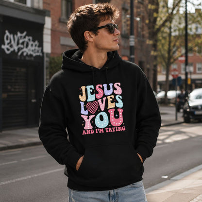 Jesus Loves You and I'm Trying black unisex hoodie by The Avielle