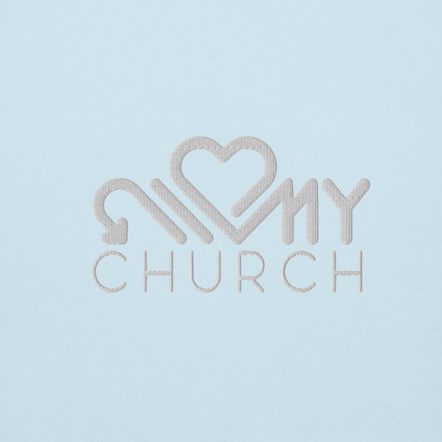 Close-up of the Love My Church white embroidery on the sky blue premium hoodie by The Avielle