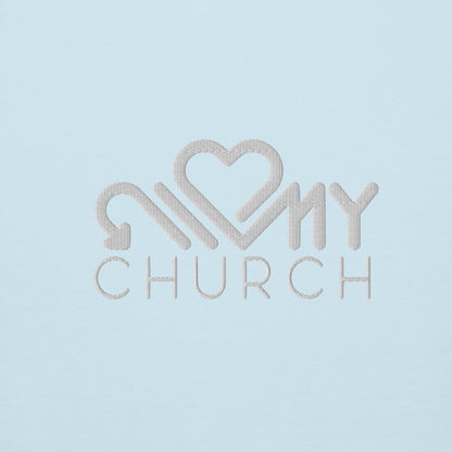 Close-up of the Love My Church white embroidery on the sky blue premium hoodie by The Avielle